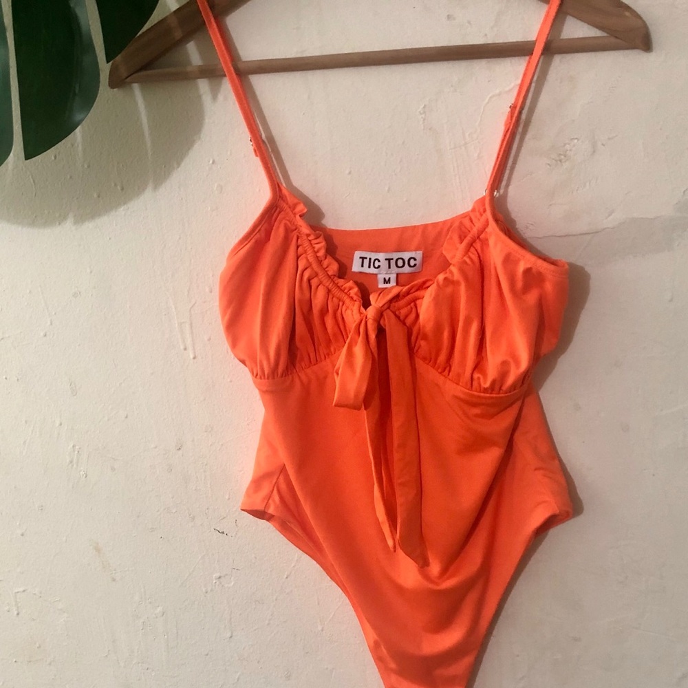 Neon orange thing body suit